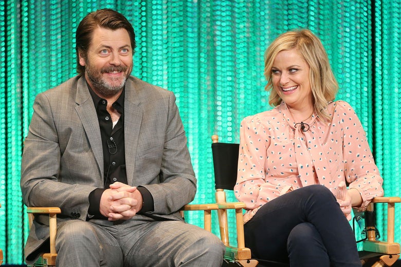HOLLYWOOD, CA - MARCH 18: Actor Nick Offerman (L) and actress Amy Poehler speak during The Paley Center for Media's PaleyFest 2014 Honoring 'Parks and Recreation' at the Dolby Theatre on March 18, 2014 in Hollywood, California. (Photo by Frederick M. Brown/Getty Images)